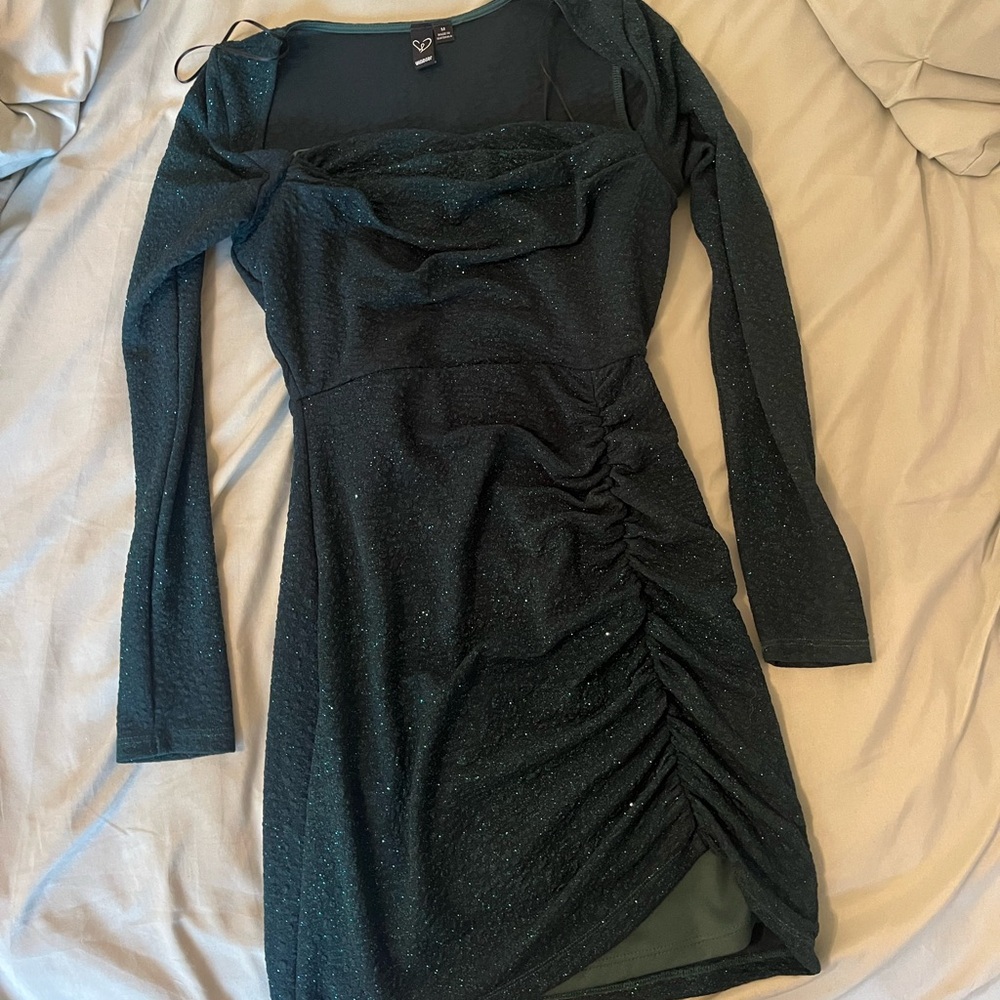 green dress with long sleeves and sparkles